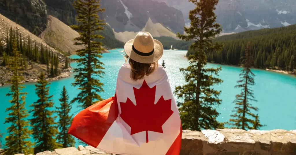 woman draped in a flag of Canada